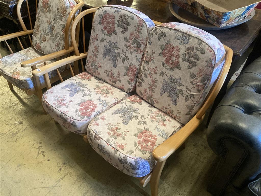 An Ercol style beech two piece lounge suite, settee 116cm, depth 74cm, height 80cm